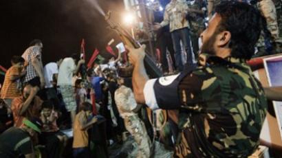Rebels raise flag over Gaddafi compound 