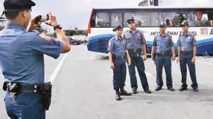 Filipino cops face demotion over posing in front of hijacked bus