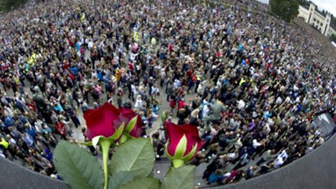 Over 100,000 mourners attend vigil for massacre victims in Oslo