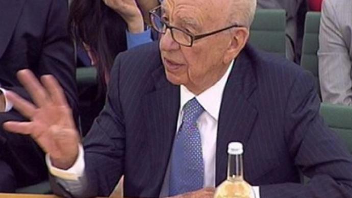 Rupert Murdoch hit with shaving cream during Parliament hearing