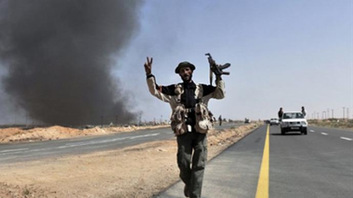 Libyan rebels retreat, forge new plan