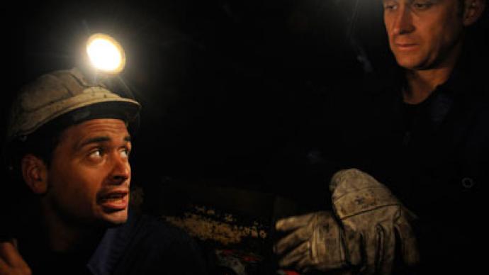 Up to 100 desperate miners barricade underground with explosives