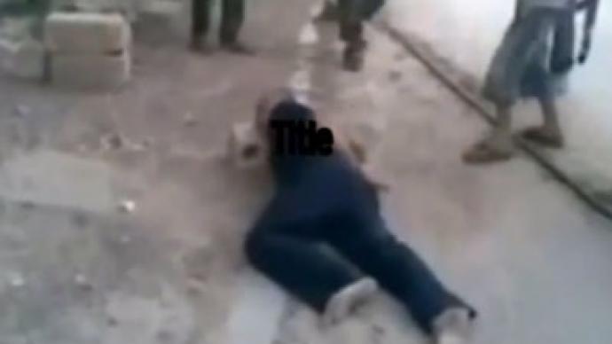 Grisly video allegedly shows Syrian rebels forcing child to behead unarmed prisoner