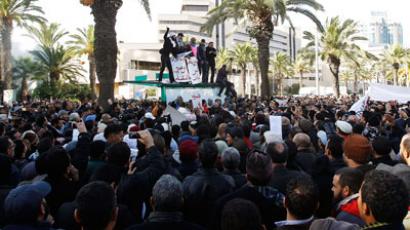 Teargas as thousands protest top opposition leader assassination in Tunisia
