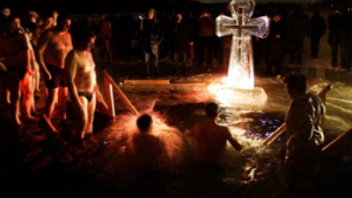 Unexpected baptism: 70 get an ice-cold dip during Orthodox celebrations