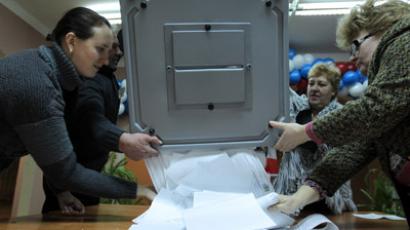United Russia wins polls under new rules, opposition cry foul