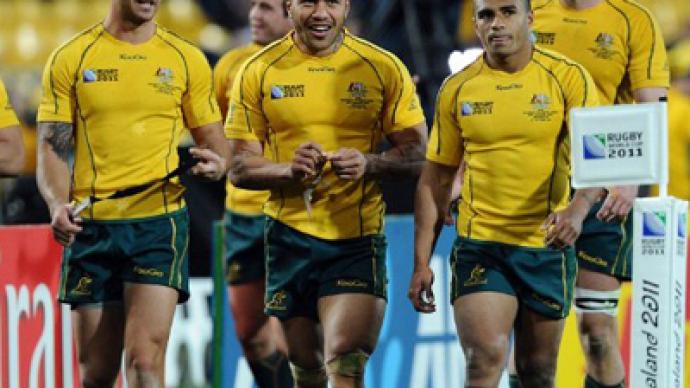 Australia knock reigning champs S. Africa out of RWC