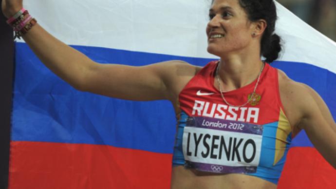 Lysenko wins hammer throw with Olympic record