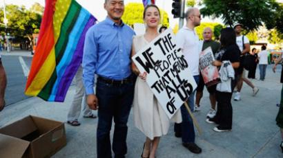 Rainbow wedding bells: Denmark allows gay marriage in church