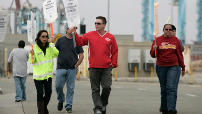 Picketing port employees enter 6th day of talks amid $1 billion per day strike
