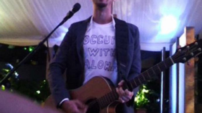Musician shocks Obama’s party with Occupy song