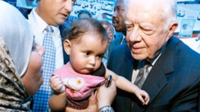 Carter heads to Cuba to dicuss held US prisoner, economy