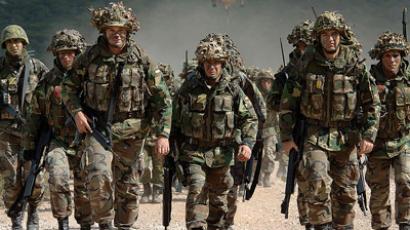 Obama praises Afghan war effort in surprise troop visit
