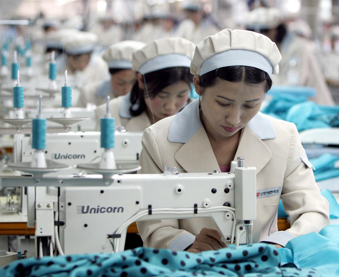 North Korean workers work at a factory of South Korean apparel maker Shinwon in the inter-Korean industrial park in Kaesong.
