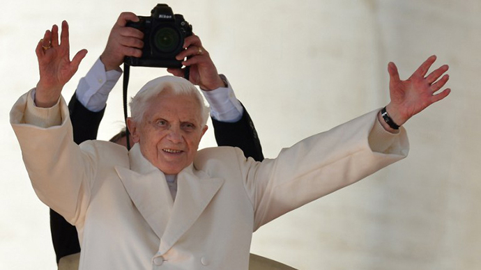 Pope Benedict XVI blesses faithful before leaving the altar at the end of his last weekly audience on February 27, 2013 at St Peter's square at the Vatican (AFP Photo / GabrielL Bouys)