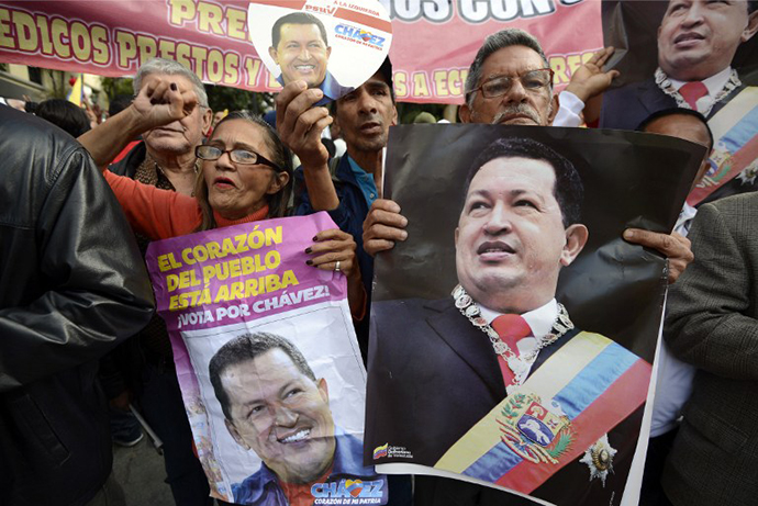 Supporters of Venezuelan President Hugo Chavez gather at Simon Bolivar Square in Caracas. (AFP Photo / Juan Baretto)