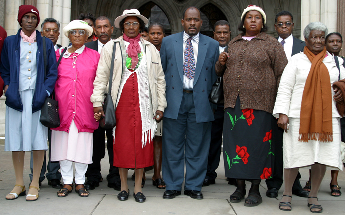 A group of refugees from the Indian Ocean island of Chagos gather outside the High Court in London on October 31, 2002. They are seeking compensation from the British government for forcibly removing them to make way for the Diego Garcia U.S. military base 30 years ago (Reuters / Michael Crabtree) 