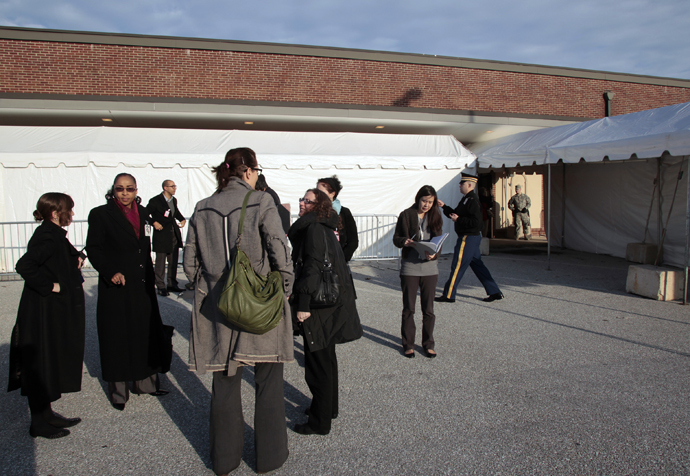 Journalists stand outside the courthouse at Fort Meade, Maryland during the US vs Private Bradley E. Manning Article 32 hearing December 16, 2011. (Reuters / Yuri Gripas)
