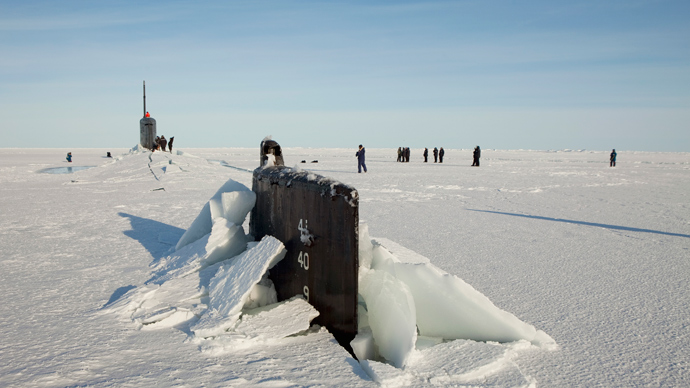A congressional delegation and the Secretary of the Navy walk around the Seawolf class submarine USS Connecticut after the boat surfaced through through Arctic sea ice during an exercise near the 2011 Applied Physics Laboratory Ice Station north of Prudhoe Bay, Alaska March 18, 2011 (Reuters / Lucas Jackson)