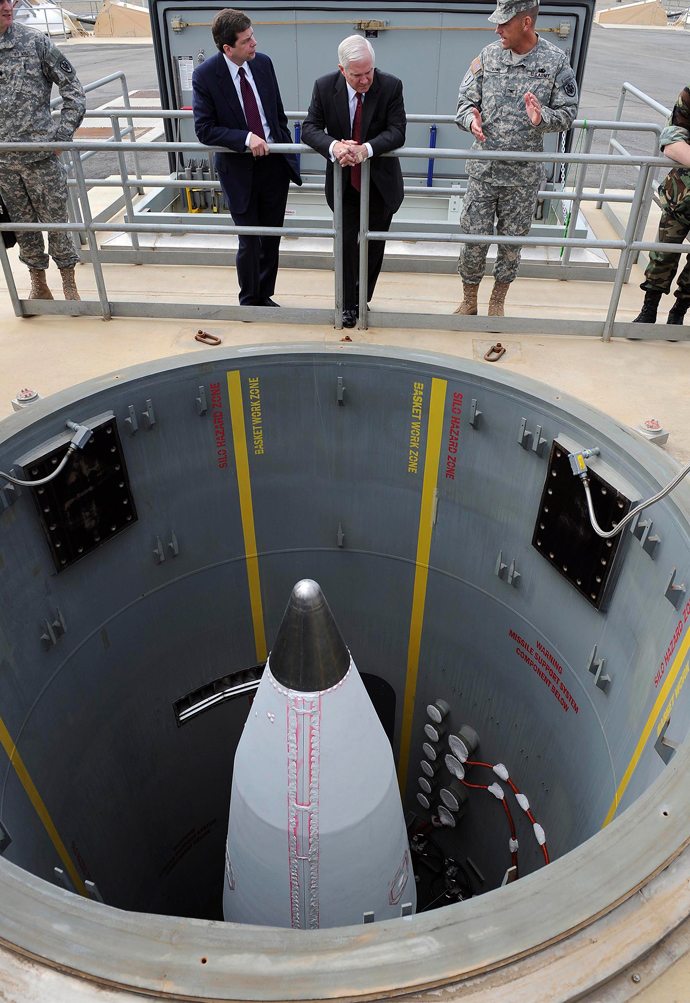 U.S. Sen. Mark Begich (D-AK), and U.S. Secretary of Defense Robert Gates (C), listen to a brief on a ground-based interceptor missile silo on Fort Greeley, Alaska, June 1, 2009 (Reuters / Jerry Morrison)