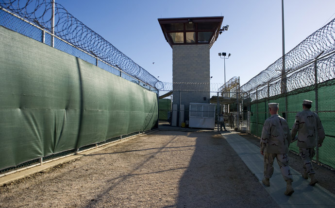 This image reviewed by the US military, show two members of the military walking out of the "Camp Six" detention facility of the Joint Detention Group at the US Naval Station in Guantanamo Bay, Cuba, January 19, 2012. (AFP Photo/Jim Watson)