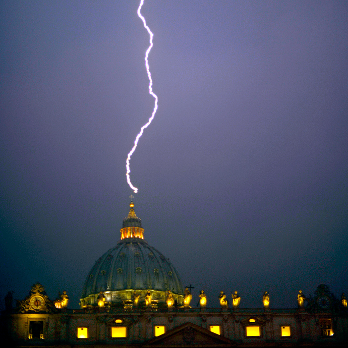 A lightning strikes St Peter's dome at the Vatican on February 11, 2013. Pope Benedict XVI announced today he will resign as leader of the world's 1.1 billion Catholics on February 28 (AFP Photo / Filippo Monteforte) 