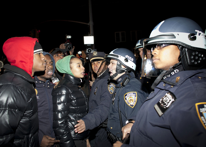 Demonstrators faceoff against police during a protest against the shooting of Kimani Gray, March 13, 2013 in the East Flatbush neighborhood of the Brooklyn borough of New York City (Allison Joyce / Getty Images / AFP) 