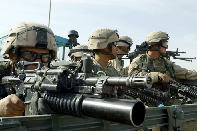 US soldiers of the 82nd Airborne division take position during a search for a weapons cache in Fallujah, 50 kms (30 miles) west of Baghdad.(AFP Photo / Patrick Baz)