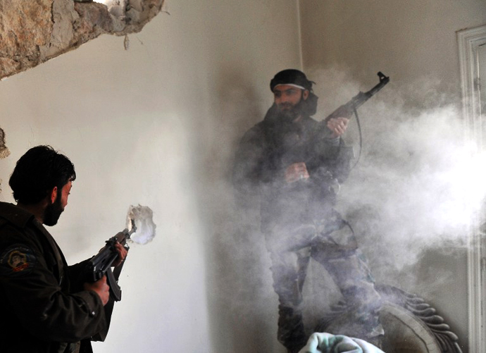 Rebels clash with Syrian government forces at Saif al-Dawla district in the northern Syrian city of Aleppo on March 23, 2013. (AFP Photo / Bulent Kilic)