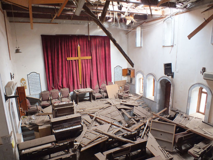 Damages are seen inside a church in the city of Homs.(Reuters / Yazan Homsy)