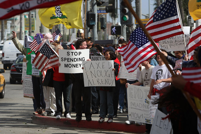 Demonstrators gather at an American Family Association (AFA)-sponsored T.E.A. (Taxed Enough Already) Party to protest taxes and economic stimulus spending on the last day to file state and federal income tax returns, April 15, 2009 in Santa Monica, California. (David McNew/Getty Images/AFP)