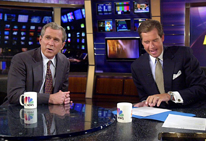George W. Bush talks with MSNBC anchor Brian Williams. (AFP Photo / Tannen Maury)