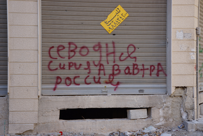 âSyria now, Russia nextâ. Itâs hard to believe that real Chechens could make this poorly spelled inscription. But each war has myths of its own. (RT photo/Nadezhda Kevorkova)