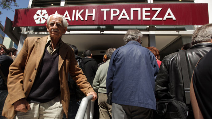 People queue up outside a Laiki bank branch in the Cypriot capital, Nicosia, on March 28, 2013.(AFP Photo / Patrick Baz)