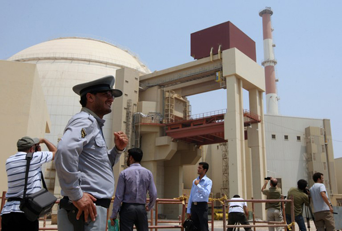 An Iranian security man stands next to journalists outside the Bushehr nuclear power plant in southern Iran. The Stuxnet computer worm has infected 30,000 computers in Iran but has failed to cause serious damage, Iranian officials were quoted as saying on September 26, 2010. (AFP Photo / Atta Kenare)
