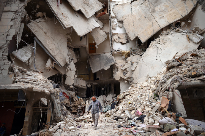 A Syrian man walks amid destruction in the northern Syrian city of Aleppo on April 10, 2013 (AFP Photo / Dimitar Dilkoff) 