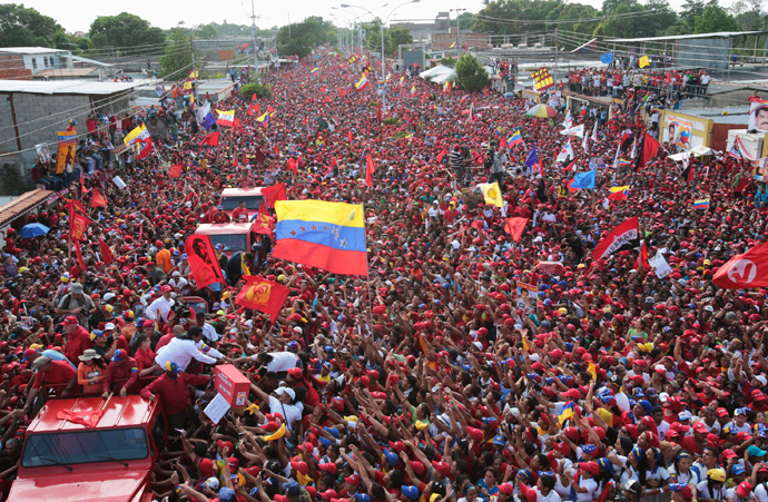 Venezuela's acting President and presidential candidate Nicolas Maduro (L) greets supporters during a campaign rally in Cumana, in the eastern state of Sucre, in this picture provided by Miraflores Palace on April 8, 2013 (Reuters)