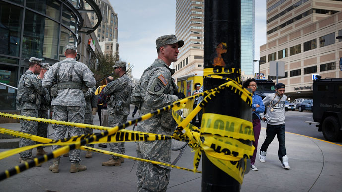 National Guard soldiers guard a roadblock near the scene of yesterday's bombing attack at the Boston Marathon on April 16, 2013 in Boston.(AFP Photo / Spencer Platt)