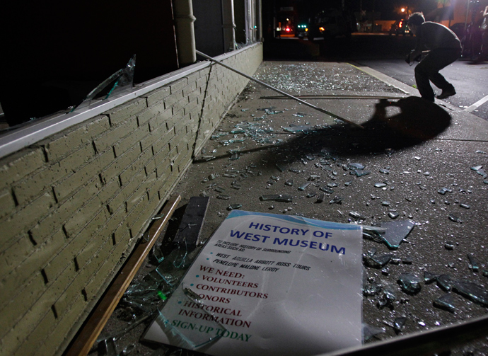 A sign rests on a sidewalk amid shattered glass after an explosion at a fertilizer plant in the town of West, near Waco, Texas early April 18, 2013 (Reuters / Mike Stone)