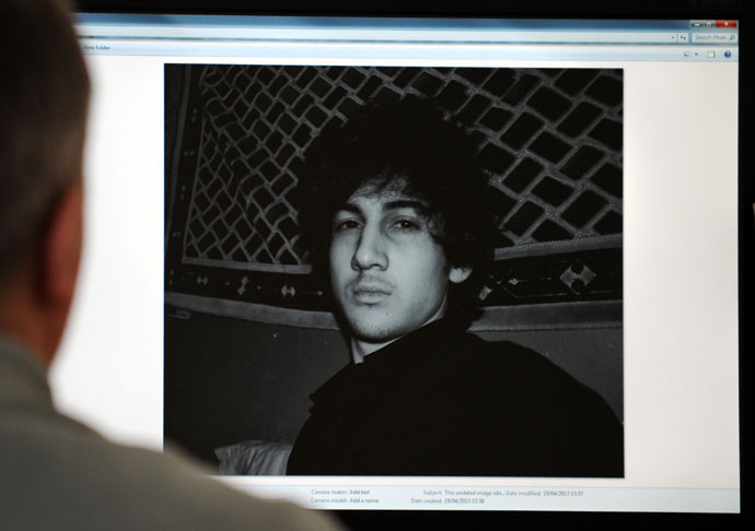 A man looks in Moscow on April 19, 2013, at a computer screen displaying an undated picture the 19-year-old Dzhokhar Tsarnaev posted on his is page in VKontakte, a Russian social media site. Dzhokhar Tsarnaev is the subject of a April 19, 2013.(AFP Photo)