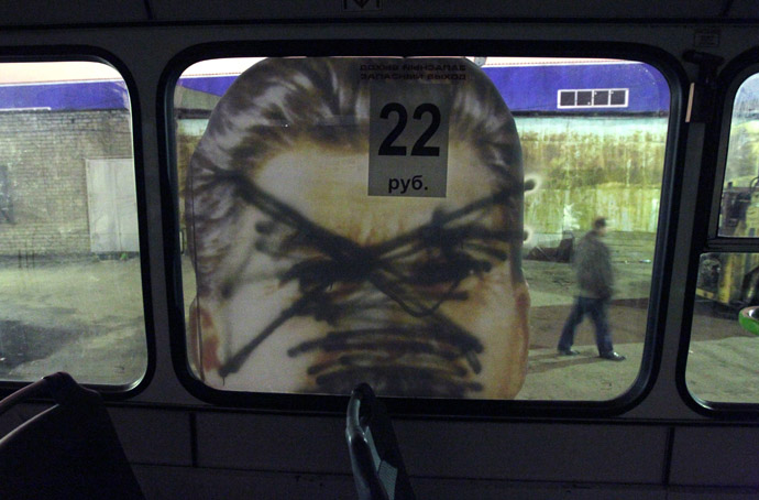A defaced portrait of former Soviet dictator Josef Stalin is seen on a bus in St.Petersburg May 5, 2010. (Reuters)
