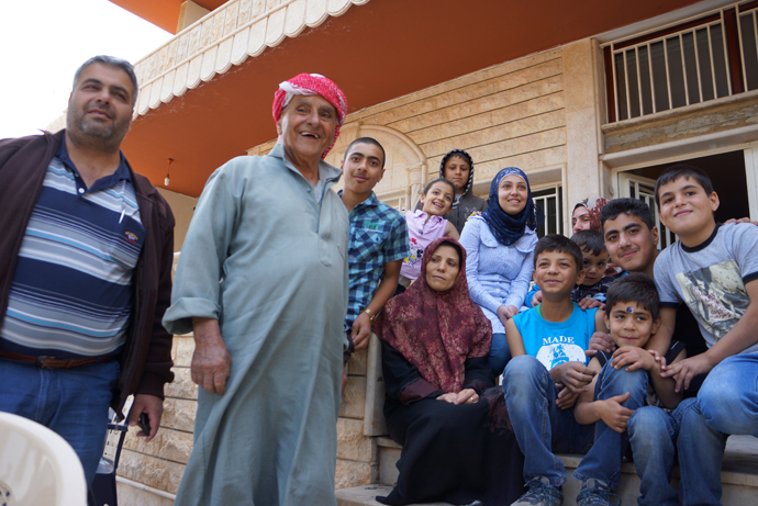 80 yo Mohhamed Hasan Kenaan and his family who survived the shelling. (Photo by Nadezhda Kevorkova)
