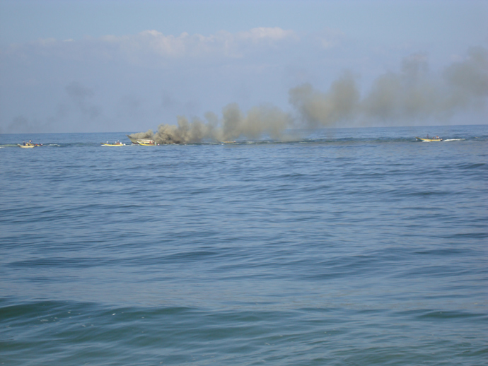 Palestinian boat attacked by Israeli gunboats with heavy machinegun fire and a missile, setting the boat aflame and completely destroying it, August 31, 2009. (Photo: Eva Bartlett/copyright RT)