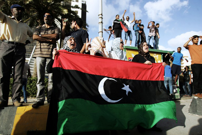 Libyan protestors shout political slogans as they call for the resignation of Benghazi's city council after a car bomb hit the eastern Libyan city earlier on May 13, 2013. (AFP Photo / Abdullah Doma)