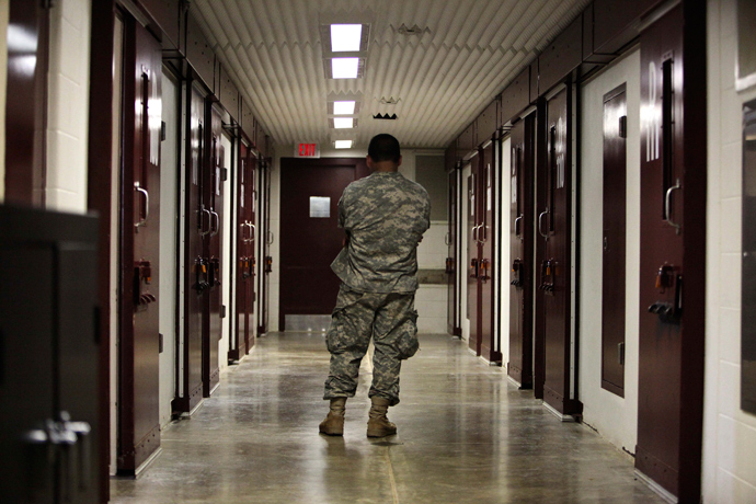In this photo, reviewed by the U.S. military, a guard stands in a cell block at Camp 5 detention facility at Guantanamo Bay U.S. Naval Base, Cuba (Reuters / Brennan Linsley)