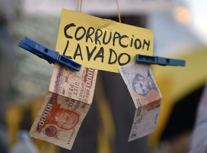View of a sign reading "Corruption, laundering" during a protest against the government of Argentine President Cristina Fernandez de Kirchner near the Obelisk in Buenos Aires on April 18, 2013. (AFP Photo / Daniel Garcia)