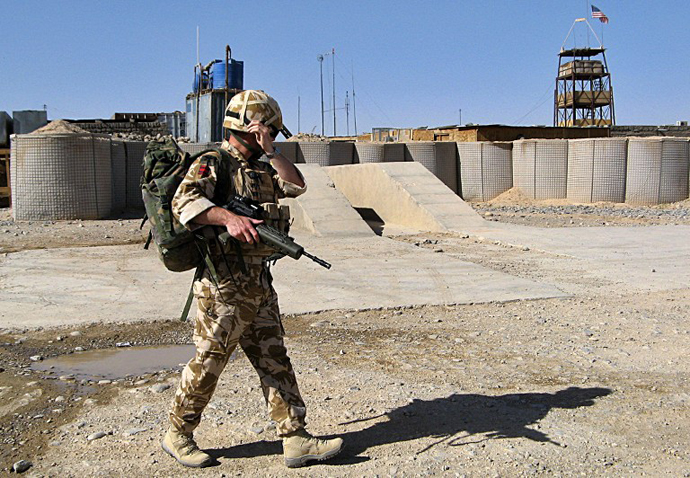 A British soldier with the NATO-led International Security Assistance Force (ISAF) walk at their base in Helmand province, Afghanistan. (AFP Photo / Abdul Malek)