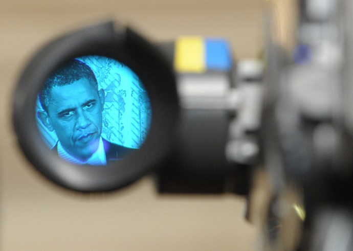 US President Barack Obama, as seen through the eyepiece of a television camera, speaks during a press conference in the East Room of the White House in Washington. (AFP Photo / Saul Loeb)