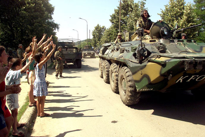 A armored personnel carrier from Russia arrives to the town of Kamenica, south east of Pristina 29 June 1999. This advance team from Russia is looking for a place to set up their head-quarters before deploying up to 1 500 troops into the US-controlled sector.(AFP Photo / Hector Mata)