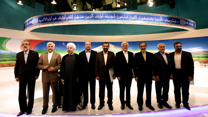 Iranian presidential candidates (L to R) former parliament speaker Gholam-Ali Haddad Adel, top nuclear negotiator Saeed Jalili, former chief nuclear negotiator Hassan Rowhani, Tehran's mayor Mohammad Baqer Qalibaf, former chief of the Revolutionary Guards Mohsen Rezai, former first vice president Mohammad Reza Aref, former foreign minister Ali Akbar Velayati, Mohammad Qarazi and state TV anchor Morteza Heidari pose for a group picture after a live debate on state TV in Tehran on June 7, 2013, ahead of the upcoming presidential elections.(AFP Photo / IRIB / Mehdi Dehghan)